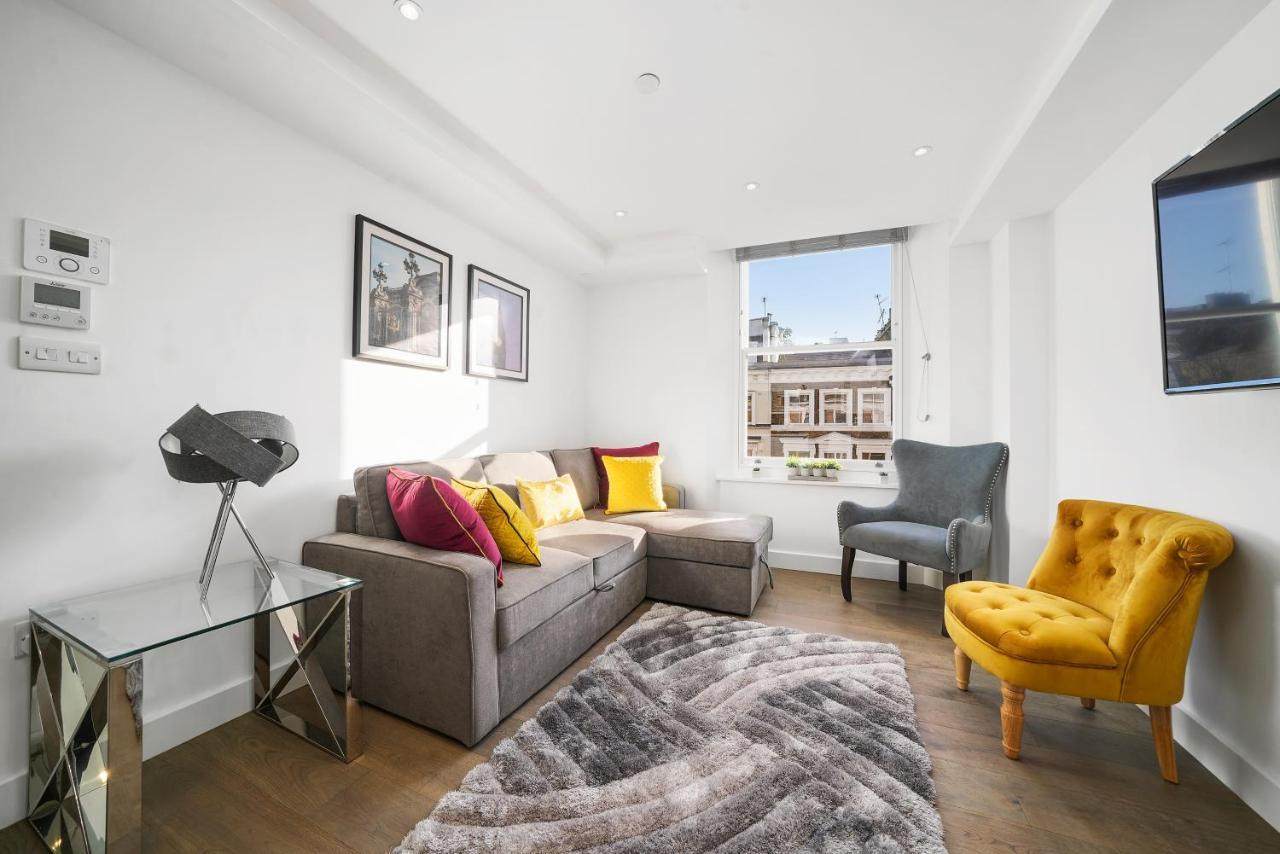 콜링엄 프라임 아파트먼트 런던 외부 사진 A living room in a serviced apartment in London